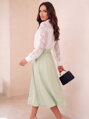Dámska elegantná midi pistáciová sukňa 